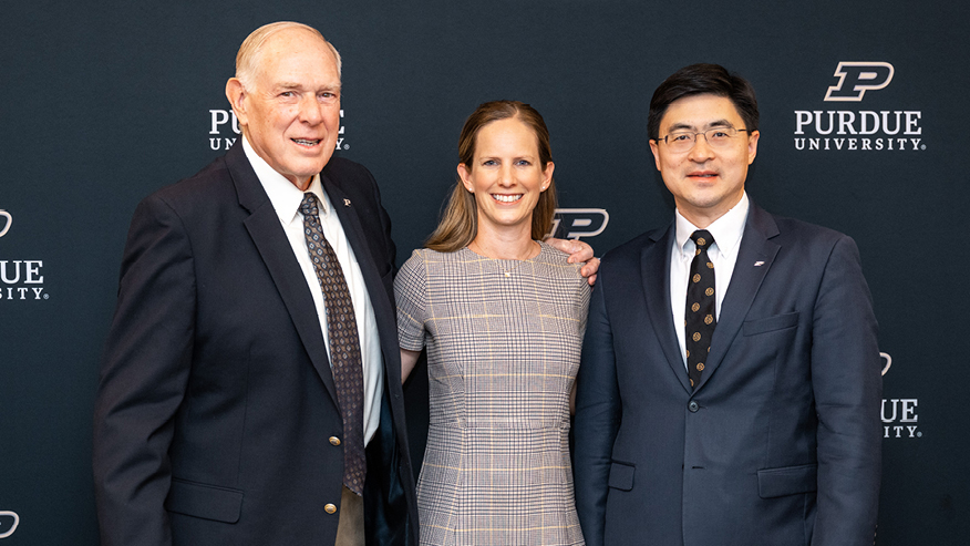 Philip Low, Brooke Beier and Mung Chiang pose for a photo
